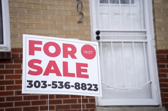 A for sale sign stands outside a single-family residence on Thursday, Nov. 23, 2023, in Denver. On Thursday, Freddie Mac reports on this week's average U.S. mortgage rates. (AP Photo/David Zalubowski)