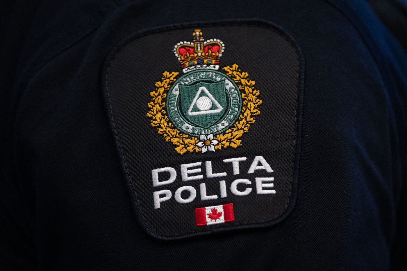 A Delta Police patch is worn by an officer at RCMP "E" Division headquarters in Surrey, B.C., on Thursday, Feb. 19, 2026. THE CANADIAN PRESS/Ethan Cairns