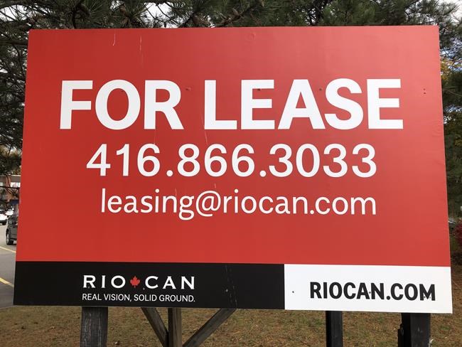 RioCan signage is shown at a strip mall in Mississauga, Ont., Saturday, Oct.24, 2020. RioCan is one of Canada's largest real estate investment trusts. THE CANADIAN PRESS/Richard Buchan