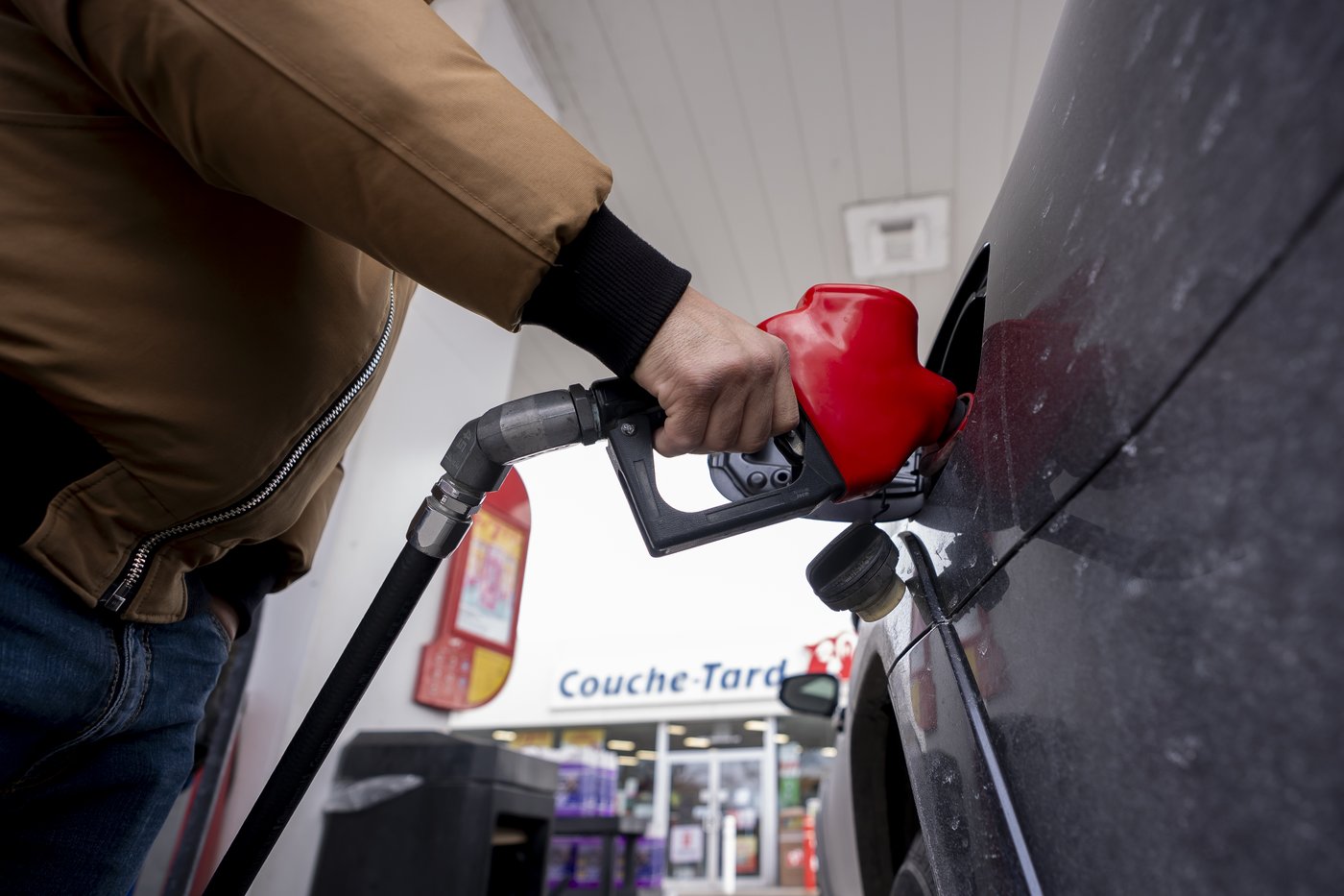 A person fills up their car at a gas station in Montreal on Thursday, March 5, 2026. THE CANADIAN PRESS/Christopher Katsarov