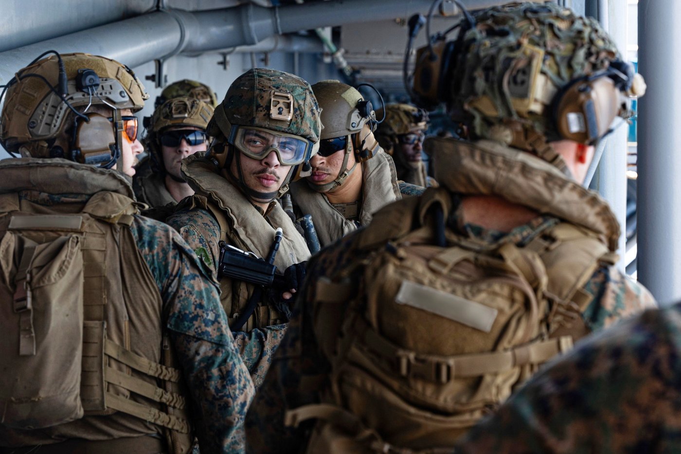 This image from video provided by U.S. Central Command shows U.S. Sailors and Marines aboard USS Tripoli (LHA 7) arriving in the U.S. Central Command area of responsibility, March 27, 2026. (U.S. Central Command via AP)