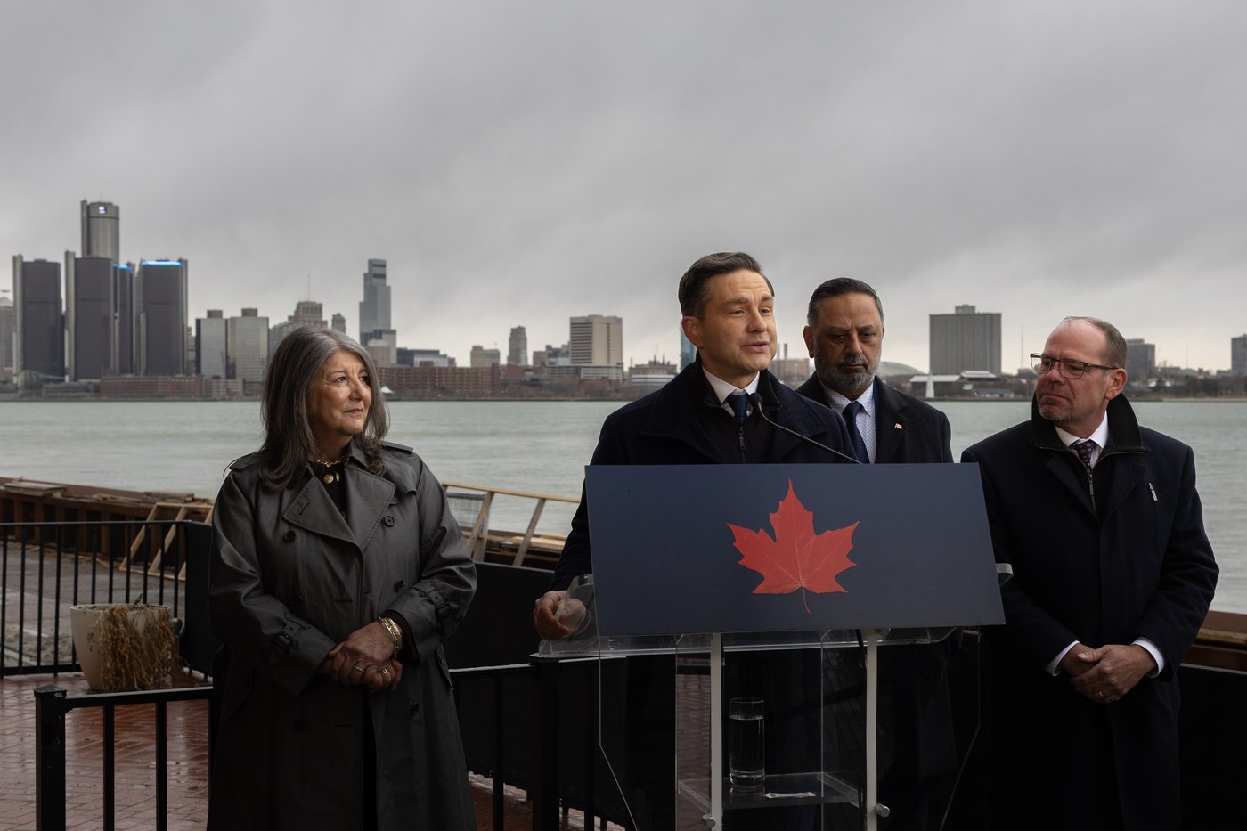 Conservative Leader Pierre Poilievre is joined by local Members of Parliament, Kathy Borrelli, left to right, Harb Gill, and Chris Lewis during a press conference outside the Windsor Club in Windsor, Ont., Friday, March 13, 2026. THE CANADIAN PRESS/Dax Melmer