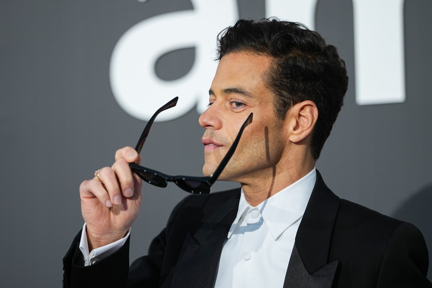 Rami Malek poses for photographers upon arrival at the amfAR Cinema Against AIDS benefit at the Hotel du Cap-Eden-Roc, during the 79th Cannes international film festival, Cap d'Antibes, southern France, Thursday, May 21, 2026. (Photo by Scott A Garfitt/Invision/AP)A