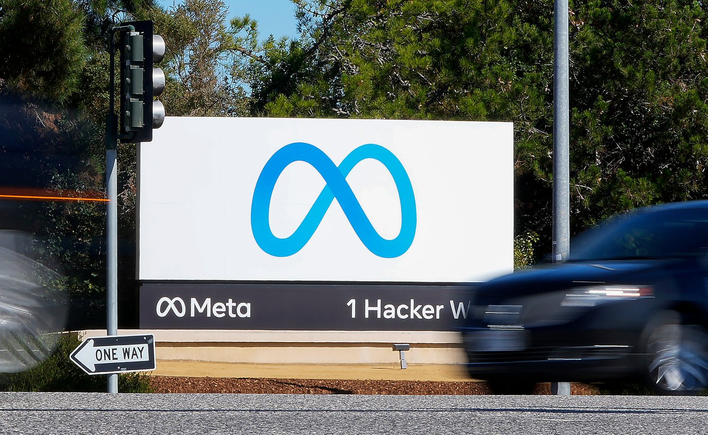 FILE - A car passes Facebook's new Meta logo on a sign at the company headquarters on Oct. 28, 2021, in Menlo Park, Calif. (AP Photo/Tony Avelar, File)