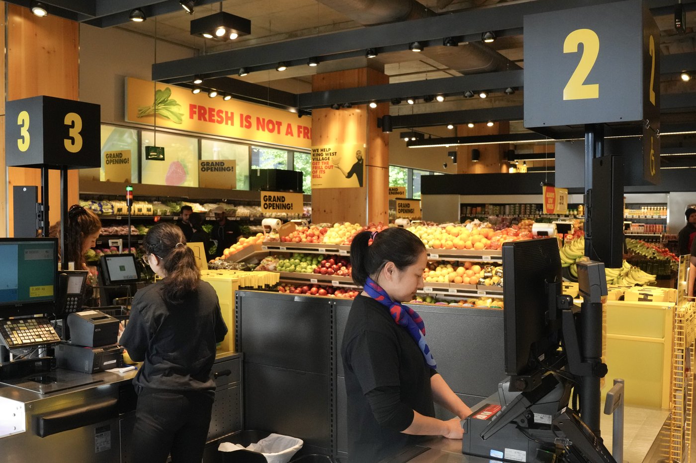 An attendant stands at the checkout, at a No Frills Grocery store in Toronto, Thursday, May 30, 2024. THE CANADIAN PRESS/Chris Young
