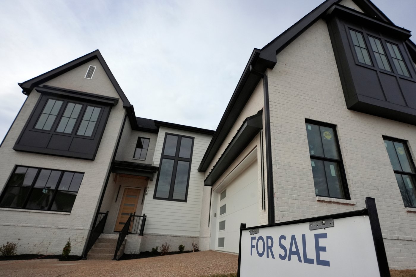 FILE - A for sale sign is posted outside a home, Feb. 10, 2026, in Nashville, Tenn. (AP Photo/George Walker IV, file)