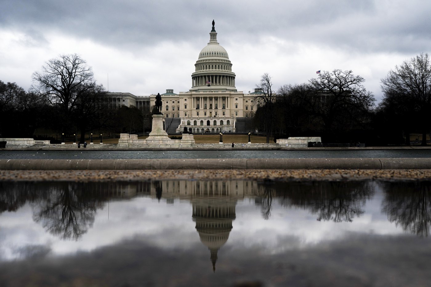 Storm clouds pass over the U.S. Capitol in Washington, Monday, March, 16, 2026. (AP Photo/Nathan Howard)