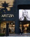 A shopper walks past Aritzia, a women's fashion luxury clothing store at an open air mall in Los Angeles on Monday, Oct. 30, 2023. (AP Photo/Richard Vogel)