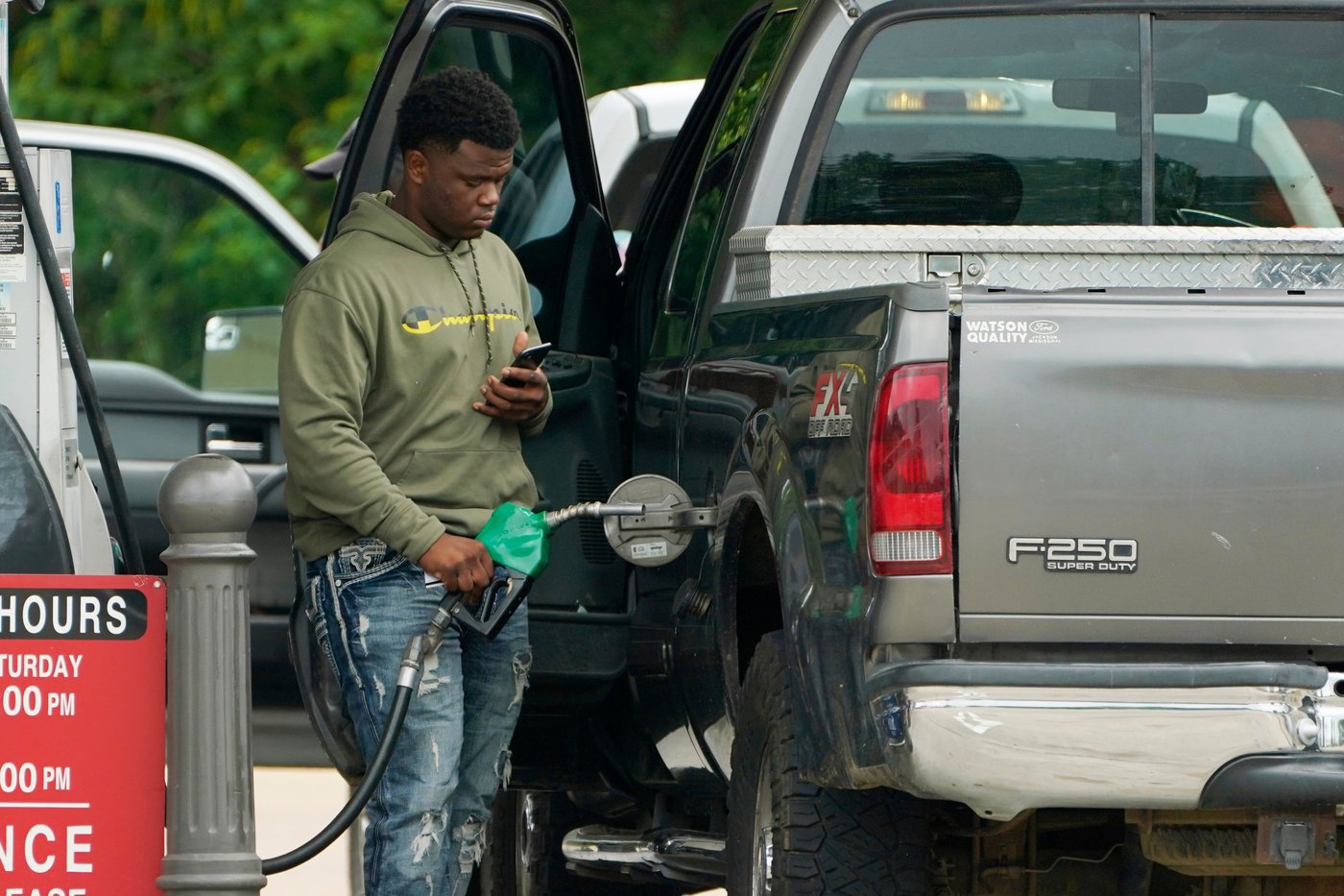 FILE - A customer prepares to pump diesel fuel at this Madison, Miss., Sam's Club, Tuesday, May 24, 2022. (AP Photo/Rogelio V. Solis, File)