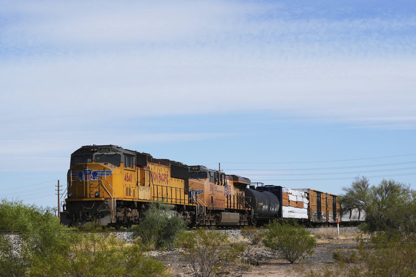 A Union Pacific freight train travels along the tracks, Thursday, April 17, 2025, in Eloy, Ariz. (AP Photo/Ross D. Franklin)