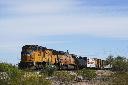 A Union Pacific freight train travels along the tracks, Thursday, April 17, 2025, in Eloy, Ariz. (AP Photo/Ross D. Franklin)