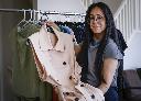 Clothing designer Nina Kharey shows off some of her designs at her home in Calgary, Tuesday, April 21, 2026.THE CANADIAN PRESS/Jeff McIntosh