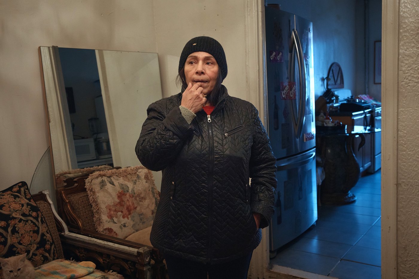 Marina Quiroz stands in her living room in a Bronx apartment building, where tenants report maintenance issues, pest infestations, Tuesday, March 17, 2026, in New York. (AP Photo/Andres Kudacki)