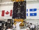 Technicians put the final touches on the second of three Radarsat Constellation Mission satellites at the MDA facility Thursday, June 21, 2018 in Montreal. THE CANADIAN PRESS/Ryan Remiorz