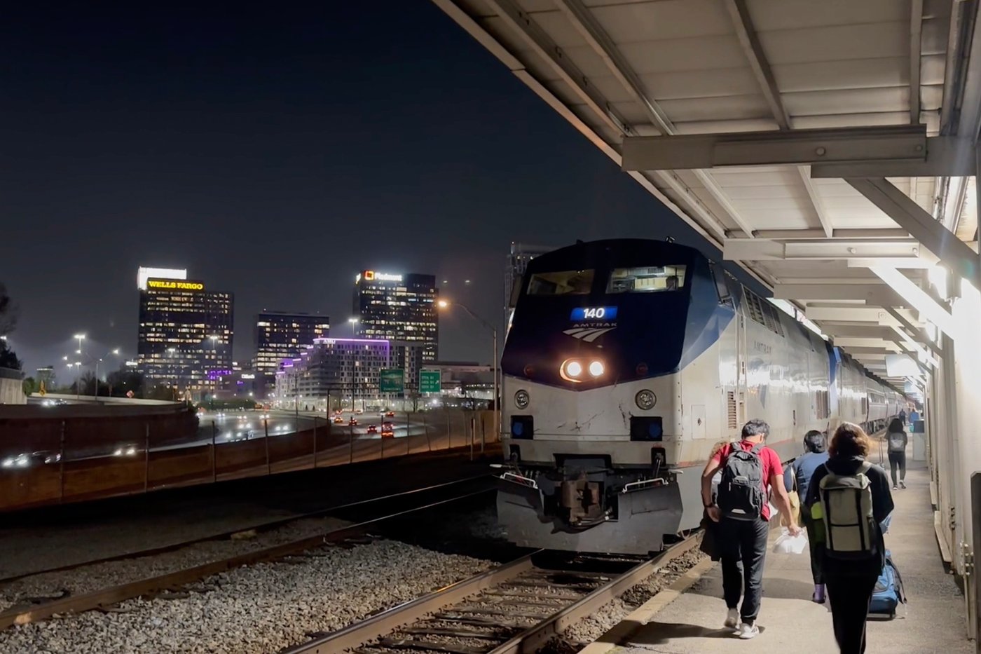 This image made from an Associated Press video shows passengers boarding the Amtrak Crescent headed towards New York on Thursday, March 26, 2026, in Atlanta. (AP Photo/Bill Barrow)