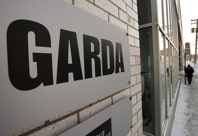 The founder of Garda World Security Corp. has signed a deal to take control of the company in a deal to acquire BC Partners' majority stake in the global security firm. GardaWorld company headquarters is seen Wednesday, December 18, 2013 in Montreal. THE CANADIAN PRESS/Ryan Remiorz