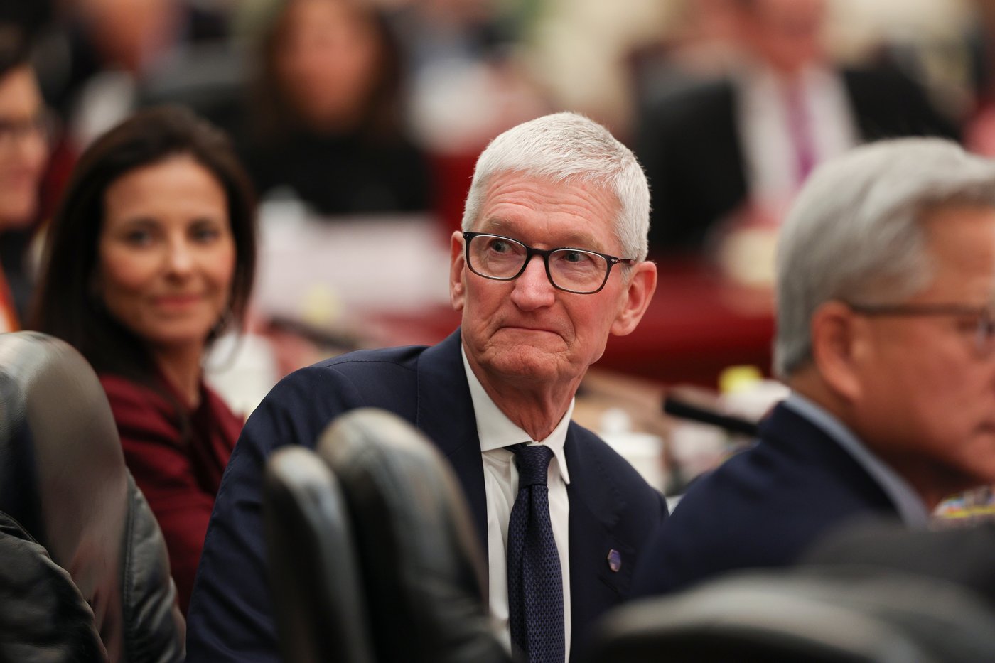 Apple CEO Tim Cook attends a meeting between Chinese Premier Li Qiang and U.S. business representatives, at the Great Hall of the People in Beijing, Thursday, May 14, 2026. (Go Nakamura/Pool Photo via AP)