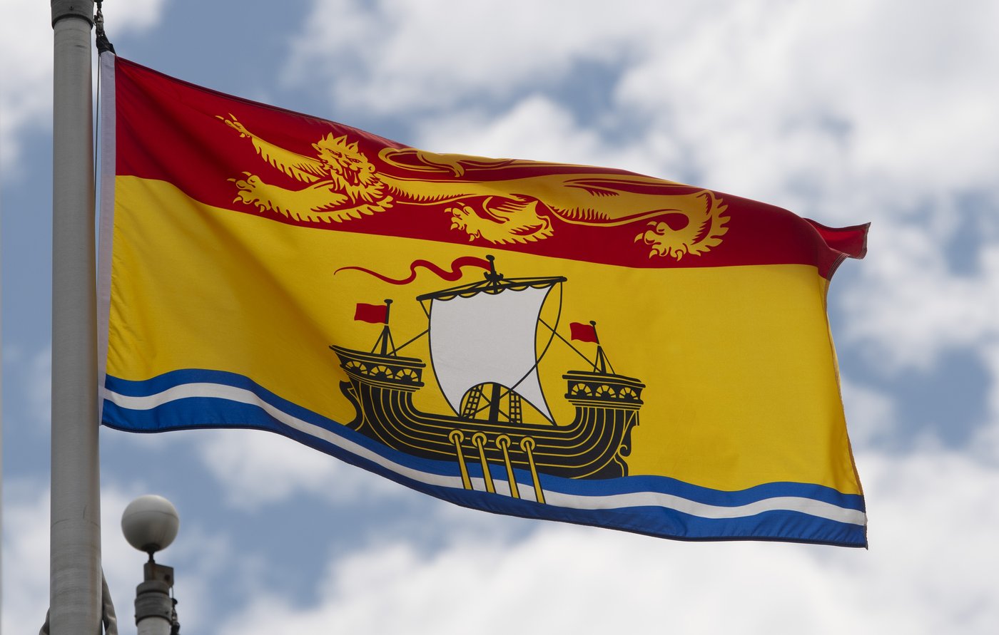 New Brunswick's provincial flag flies on a flagpole in Ottawa on Friday, July 3, 2020. THE CANADIAN PRESS/Adrian Wyld