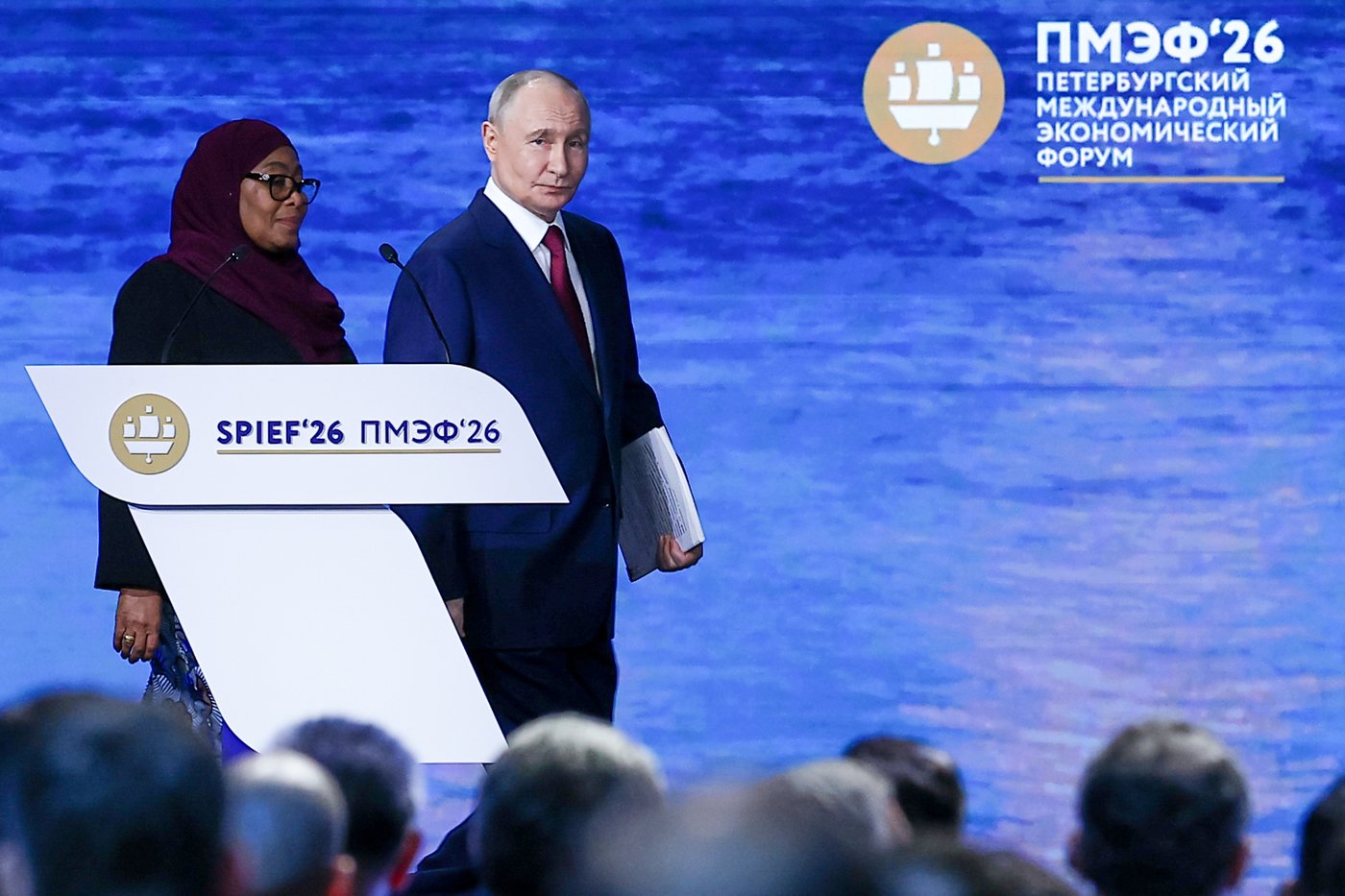 In this photo released by the Roscongress Foundation, Russian President Vladimir Putin, center, and Tanzanian President Samia Suluhu Hassan arrive to attend a plenary session at the St. Petersburg International Economic Forum in St. Petersburg, Russia, on Friday, June 5, 2026. (Vyacheslav Viktorov/Roscongress Foundation via AP)