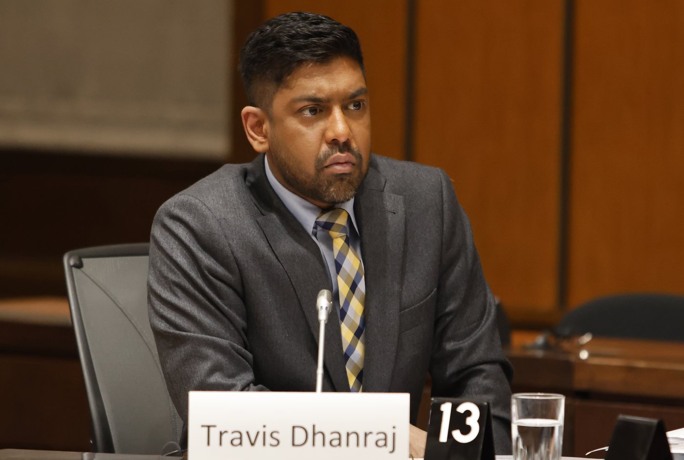 Former CBC journalist Travis Dhanraj waits to appear before the Standing Committee on Canadian Heritage (CHPC) in Ottawa on Tuesday, March 10, 2026. THE CANADIAN PRESS/ Patrick Doyle