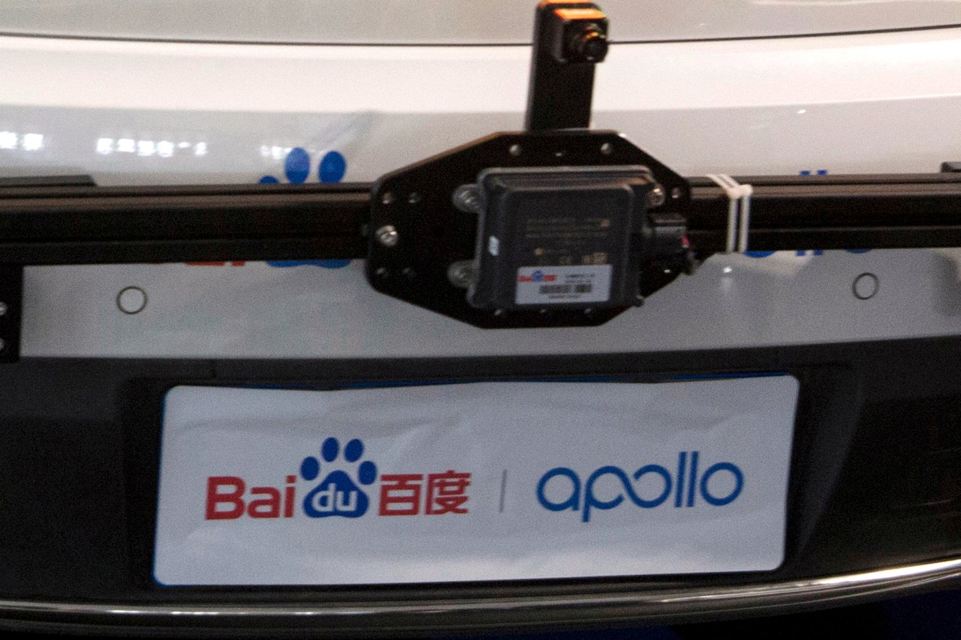 FILE -FILE - The logo for Baidu and Apollo autonomous driving platform is seen at the Baidu Create 2018 held in Beijing on July 4, 2018. (AP Photo/Ng Han Guan, File)