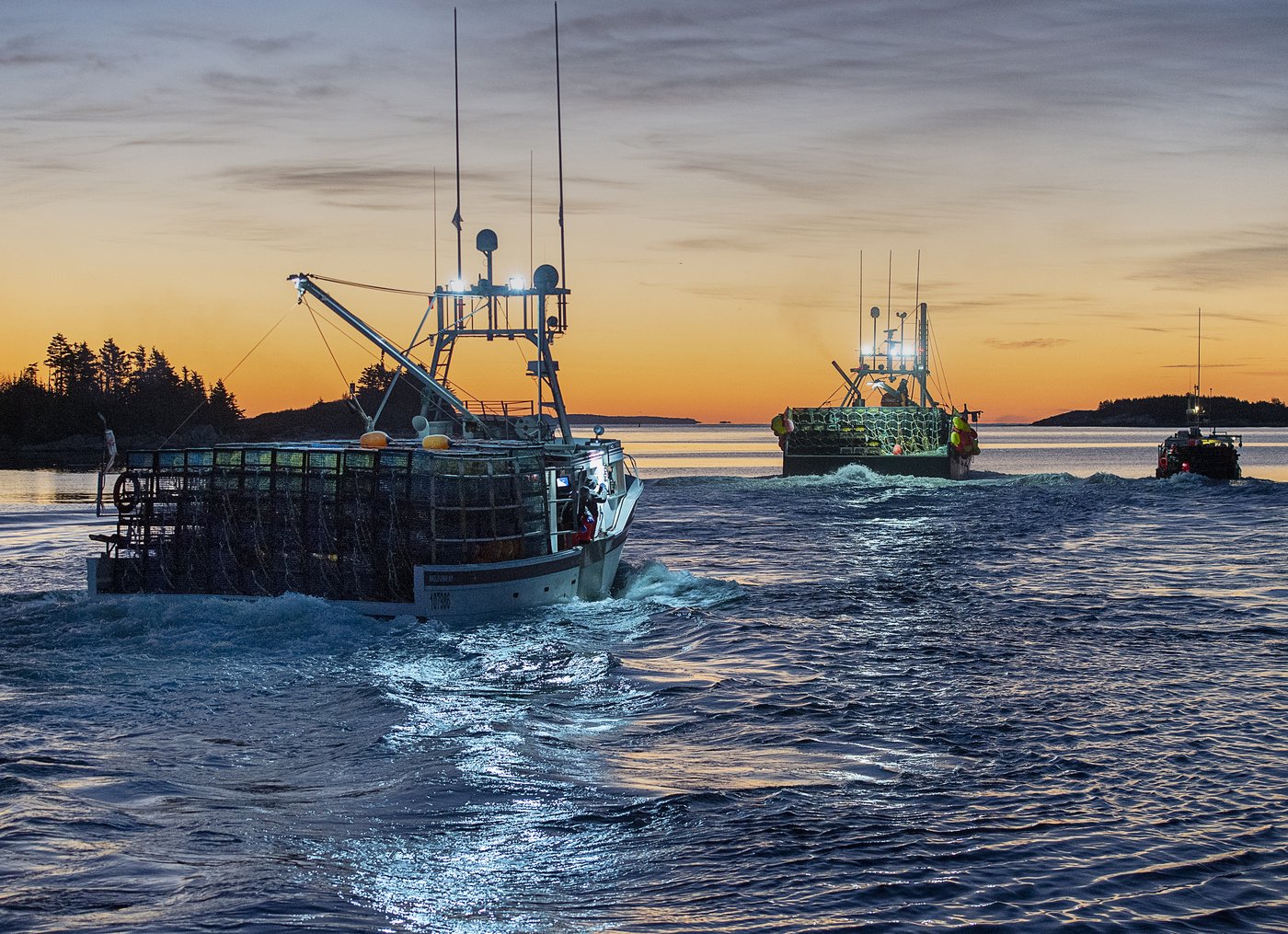Boats loaded with traps head from the harbour in West Dover, N.S. on Monday, Nov. 30, 2020. THE CANADIAN PRESS/Andrew Vaughan