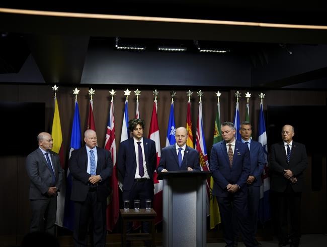 Paul Boucher, President, Teamsters Canada Rail Conference (TCRC) speaks during a press conference to announce the results of strike votes at Canadian National (CN) and Canadian Pacific Kansas City (CPKC) on Parliament Hill in Ottawa on Wednesday, May 1, 2024. He is joined by fellow teamsters. THE CANADIAN PRESS/Sean Kilpatrick