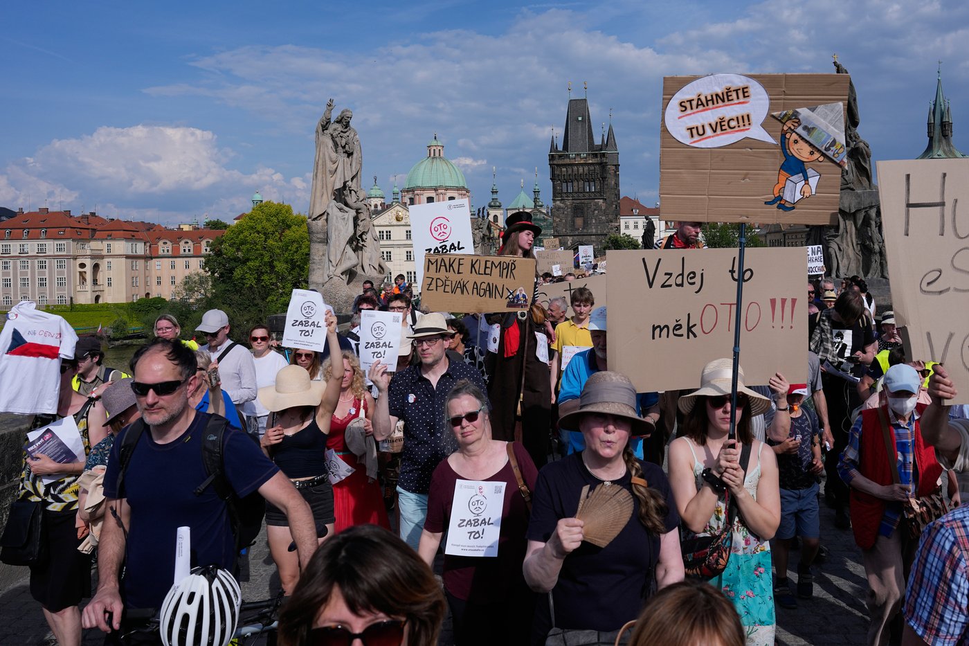 Thousands of people march to protest against a government plan to change public broadcaster funding in Prague, Czech Republic, Sunday, May 24, 2026. (AP Photo/Petr David Josek)
