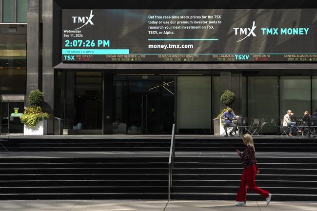 A person walks past the TMX Market Centre in Toronto, Wednesday, Sept. 11, 2024. THE CANADIAN PRESS/Paige Taylor White