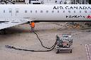 FILE - A worker fuels an Air Canada jet at DFW International Airport in Grapevine, Texas, Tuesday, April 14, 2026. (AP Photo/LM Otero, File)