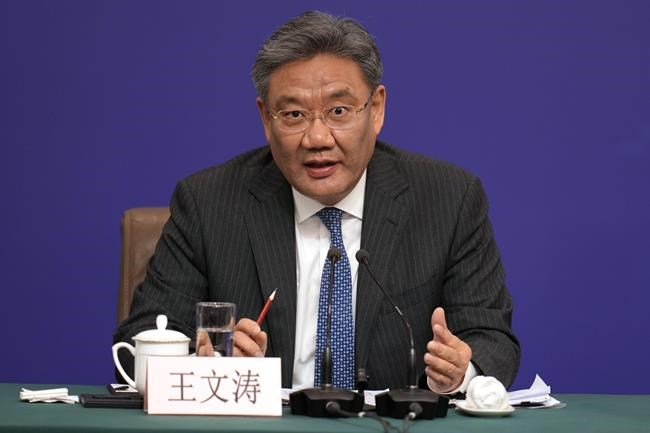 FILE - Chinese Commerce Minister Wang Wentao speaks at a press conference on the sideline of the National People's Congress in Beijing, Wednesday, March 6, 2024. (AP Photo/Ng Han Guan, File)