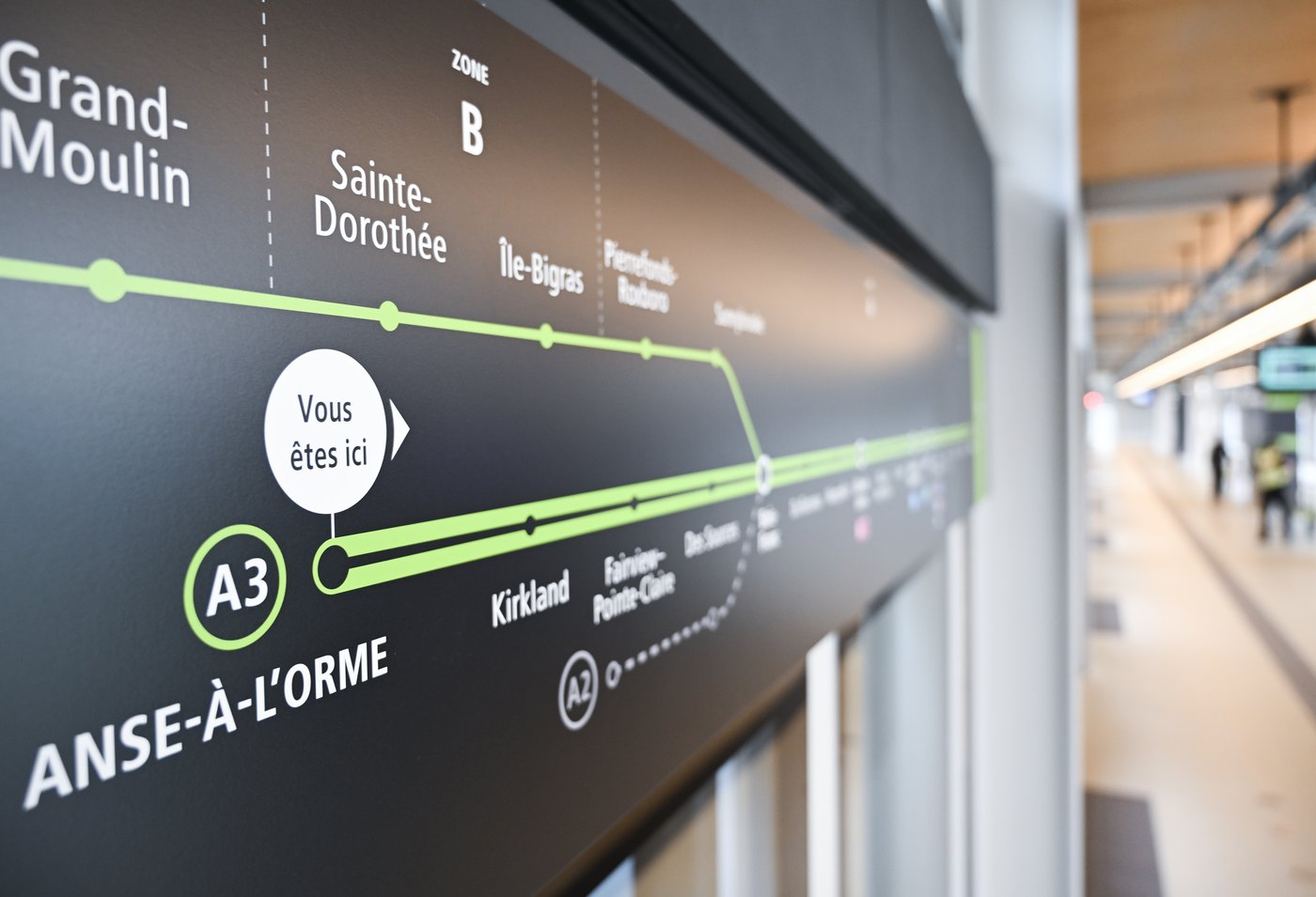 A sign displaying the REM light rail system's station stops is shown at the Anse-a- l'Orme REM station during its inaugural run on the West Island line in Montreal, on Friday, May 15, 2026. THE CANADIAN PRESS/Graham Hughes