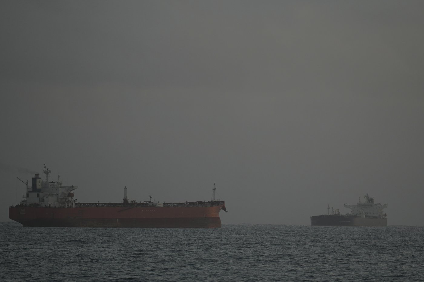 Russian-flagged oil tanker Anatoly Kolodki, right, approaches Matanzas, Cuba, Tuesday, March 31, 2026.. (AP Photo/Ramon Espinosa)