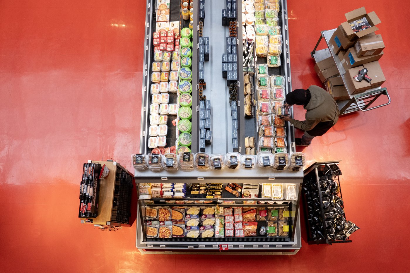 An employee stocks a display at a grocery store in Toronto on Thursday, March 12, 2026. THE CANADIAN PRESS/Chris Young