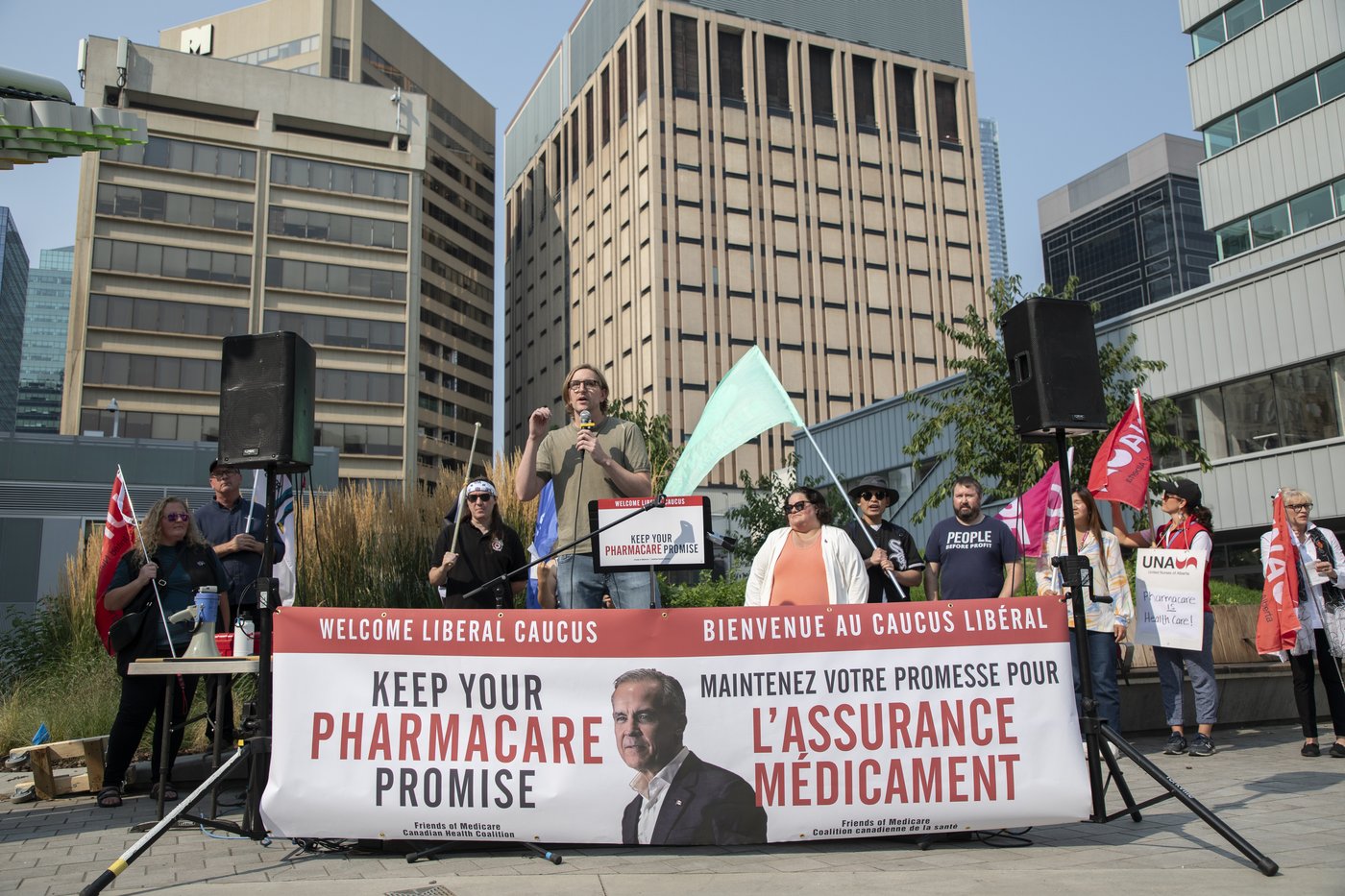 People call on Prime Minister Mark Carney to support pharmacare during a protest outside the Liberal caucus in Edmonton on Tuesday Sept. 9, 2025. THE CANADIAN PRESS/Amber Bracken