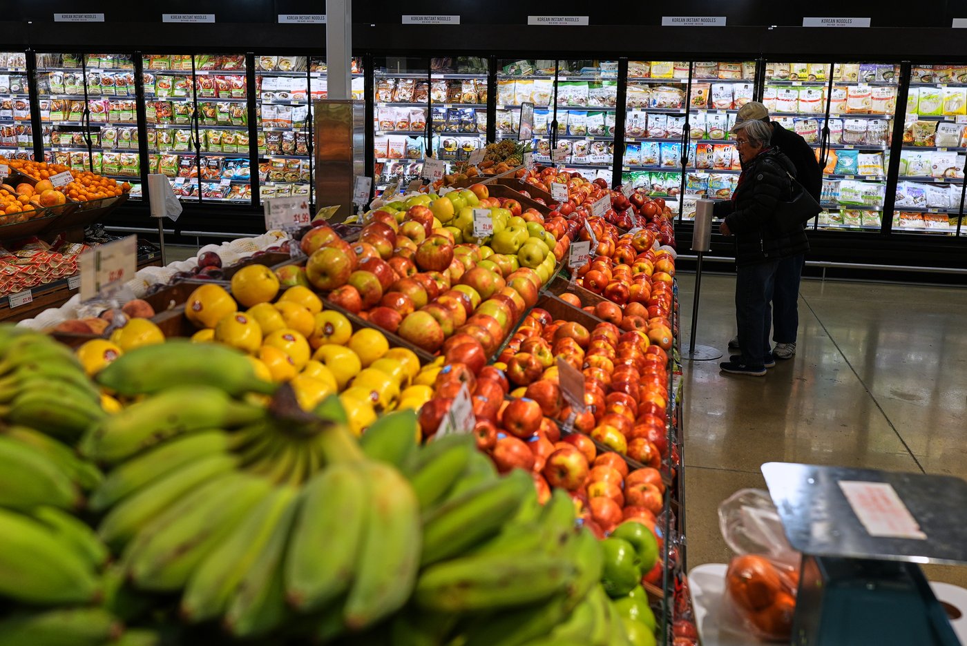 People shop at a grocery store, in Schaumburg, Ill., Thursday, April 2, 2026. (AP Photo/Nam Y. Huh)