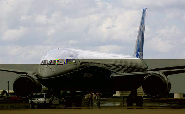 Air Canada says it has placed a firm order for 18 Boeing 787-10 Dreamliner aircraft that will be used to replace older, less efficient wide-body aircraft in its fleet. In this Friday, March 31, 2017, file photo, Boeing employees walk the new Boeing 787-10 Dreamliner down towards the delivery ramp area at the company's facility in South Carolina after conducting its first test flight at Charleston International Airport in North Charleston, S.C. THE CANADIAN PRESS/AP-Mic Smith