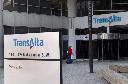 A woman walks towards the entrance of the TransAlta headquarters building in Calgary, on Tuesday, April 29, 2014. THE CANADIAN PRESS/Larry MacDougal