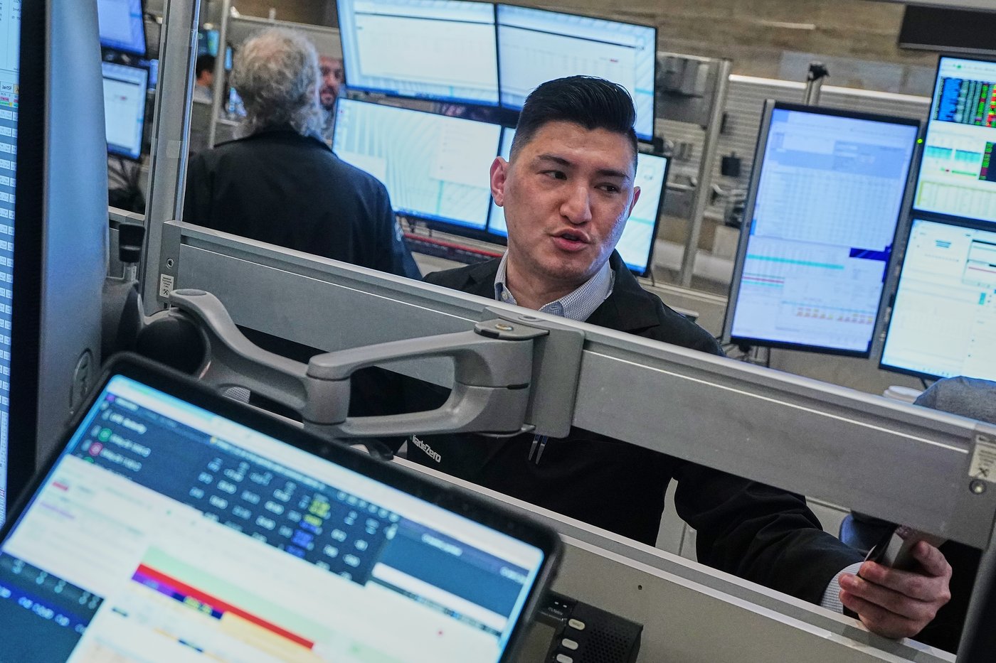 Options trader Tommy Nguyen works on the floor of the New York Stock Exchange, Tuesday, May 5, 2026. (AP Photo/Richard Drew)