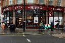 People walk by a branch of a Pret A Manger, in London, Tuesday, May 29, 2018. A&W Revenue Royalties Income Fund says it has reached an agreement in principal with the U.K.-based Pret A Manger chain for the master franchisor rights to Canada. THE CANADIAN PRESS/AP-Matt Dunham