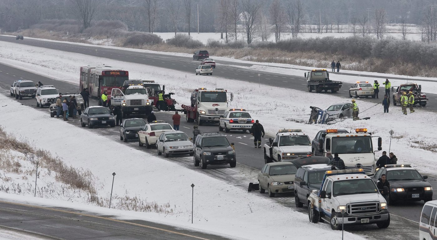 The scene of a multiple car pile up on Highway 416 northbound at Bankfield Dr. just south of Ottawa on Monday Dec. 14, 2009. THE CANADIAN PRESS/Pawel Dwulit
