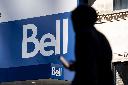 People walk bast a Bell store in downtown Montreal on Wednesday, May 7, 2025. THE CANADIAN PRESS/Christopher Katsarov