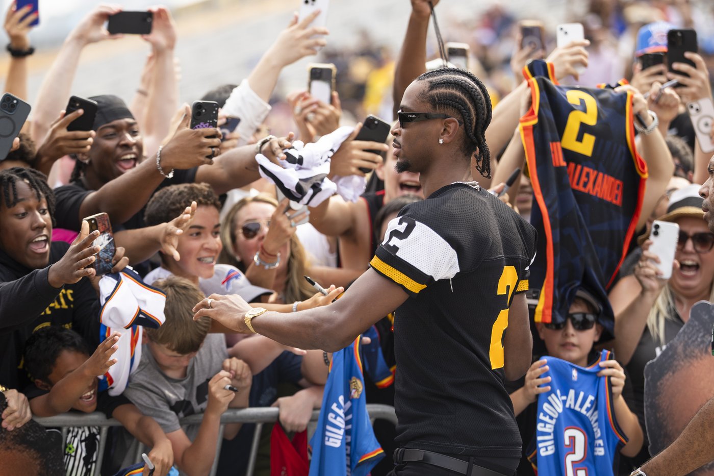 Shai Gilgeous-Alexander, point guard for the NBA champion Oklahoma City Thunder and 2024-25 NBA most valuable player, greets fans during a ceremony in Hamilton, Ont., Thursday, Aug. 7, 2025. THE CANADIAN PRESS/Nick Iwanyshyn