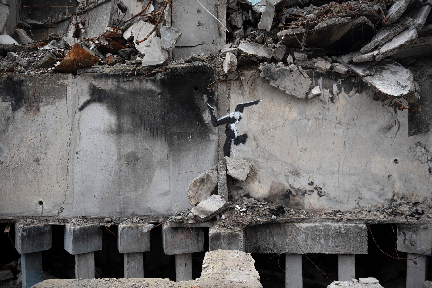 FILE - A painting by British street artist Banksy is seen on a building destroyed by fighting in Borodyanka, Kyiv region, Ukraine, Sunday, Nov. 13, 2022. (AP Photo/Andrew Kravchenko, File)