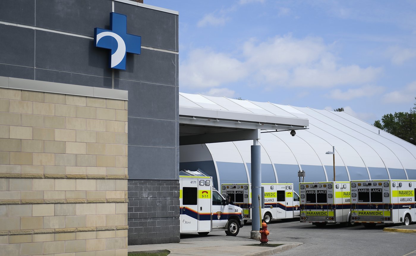 Ambulances are parked outside the emergency department at the Ottawa Hospital Civic Campus in Ottawa on Monday, May 16, 2022. THE CANADIAN PRESS/Justin Tang