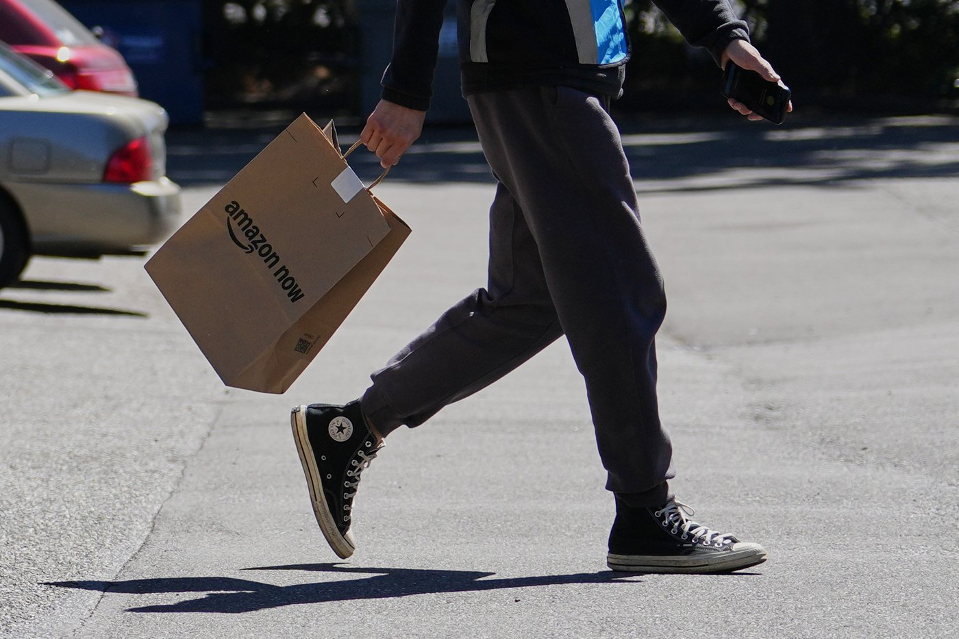 A driver picks up an order at an Amazon Now location, Monday, May 11, 2026, in Bellevue, Wash. (AP Photo/Lindsey Wasson)