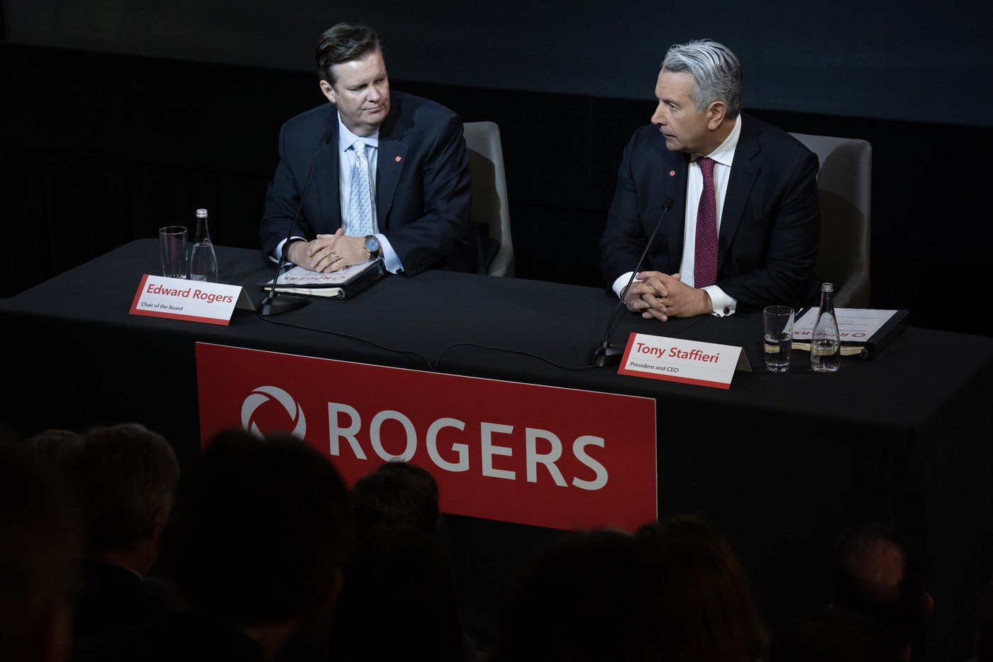 Rogers chair of the board Edward Rogers, left, talks with CEO Tony Staffieri at the telecommunications company's AGM, in Toronto, Wednesday, April 26, 2023. THE CANADIAN PRESS/Chris Young