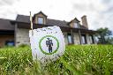 A sign indicating a lawn was treated without pesticides is displayed in front of a home in Granby, Que., on Thursday, July 23, 2026. THE CANADIAN PRESS/Christinne Muschi