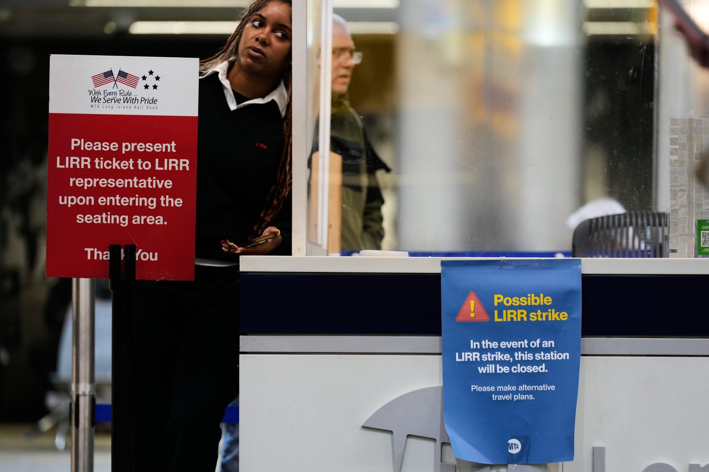 A sign warns commuters of a potential Long Island Rail Road strike at Penn Station in New York, Thursday, May 14, 2026. (AP Photo/Seth Wenig)