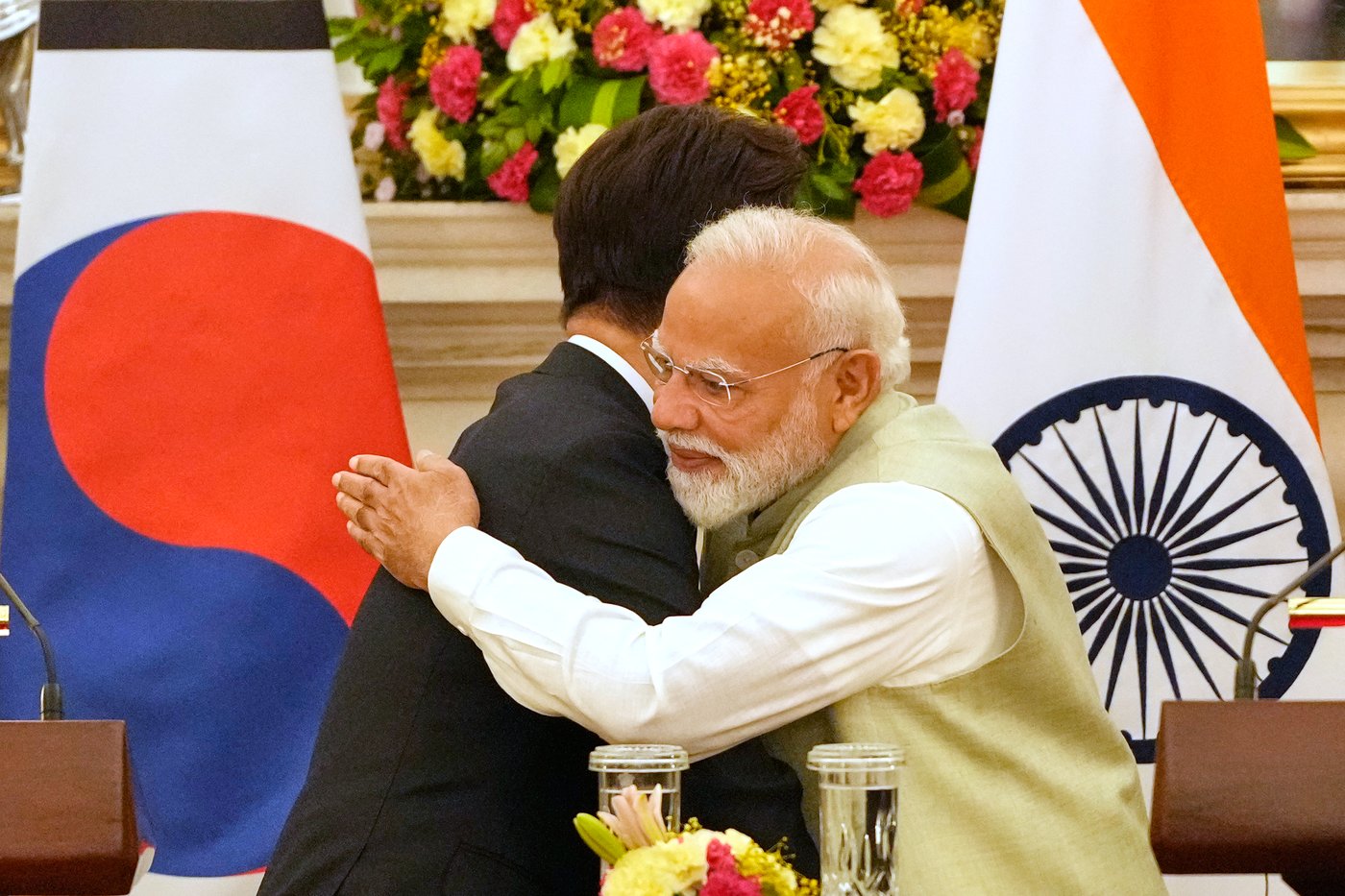 India Prime Minister Narendra Modi hugs South Korean President Lee Jae Myung, left, after the signing of memorandum of understanding and agreements between their countries in New Delhi, India, Monday, April 20, 2026. (AP Photo/Manish Swarup)